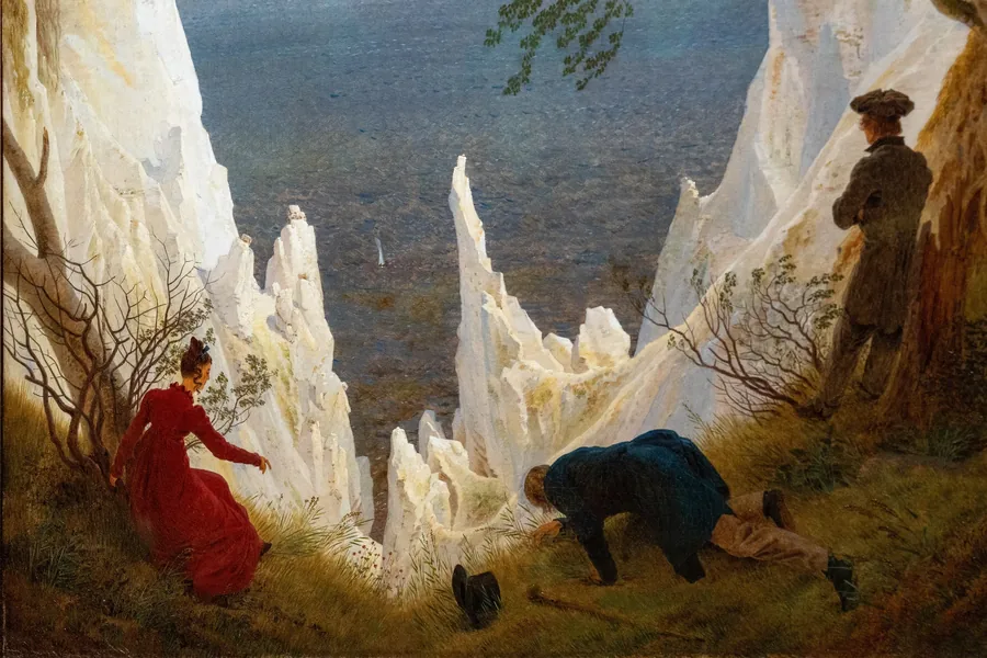 Figures at the edge of white chalk cliffs above a dark sea, after Caspar David Friedrich